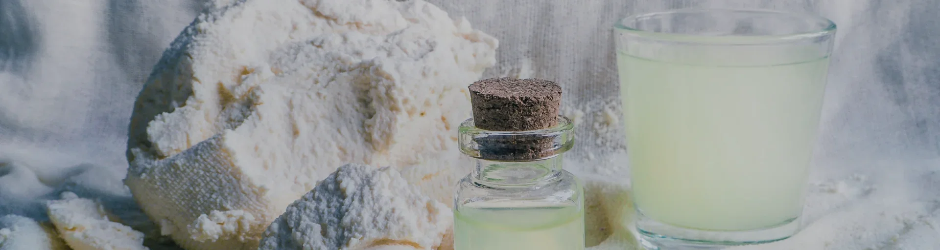 Cheese and whey in glass and flask