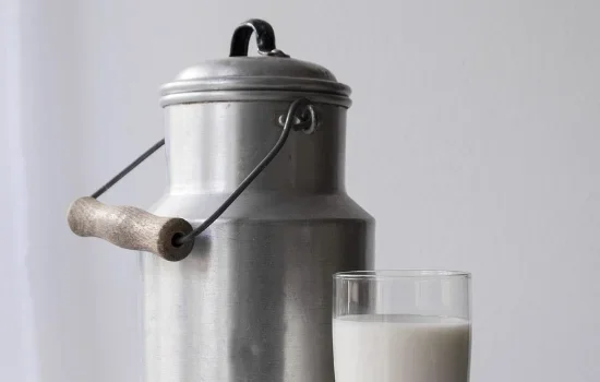 Milk can and glass
